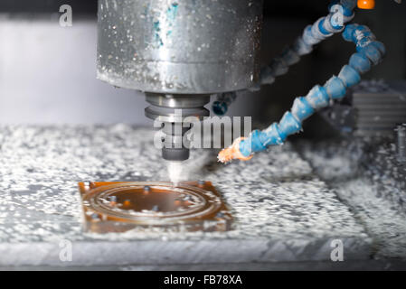 CNC drilling machine in a modern plant making plastic detail Stock Photo