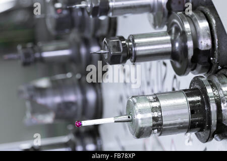 CNC industrial metal work bore cutting tool on automated lathe changer carousel Stock Photo