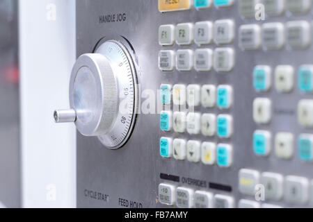 Control panel of CNC machining center with handle jog in focus. Shallow depth of field. Stock Photo