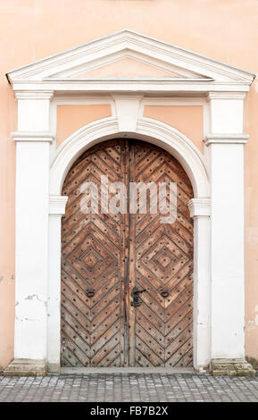 Old brown door of the church Stock Photo
