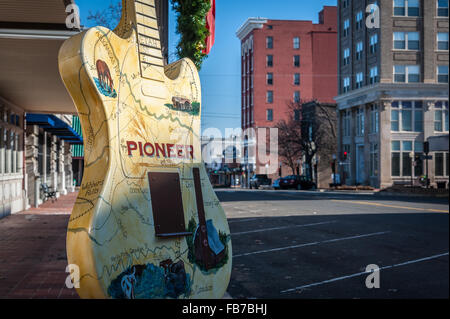 Downtown scene with painted guitar markers in Muskogee, Oklahoma, home of the Oklahoma Music Hall of Fame. USA. Stock Photo