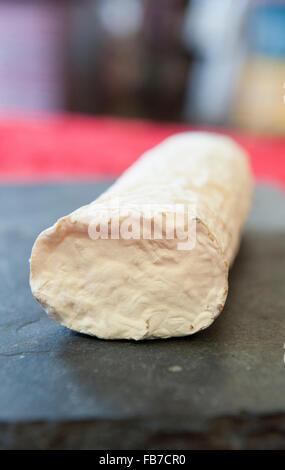 Matured goats cheese log with a creamy-white mould rind. Ragstone by Neil's Yard Stock Photo