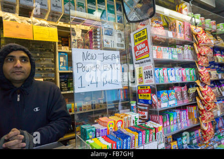 New York, USA. 11th Jan, 2016. A lottery seller hangs his handwritten updated $1.4 billion Powerball sign on Monday, January 11, 2016. The jackpot has rolled over 18 times with no winner with the next drawing Wednesday. Credit:  Richard Levine/Alamy Live News Stock Photo