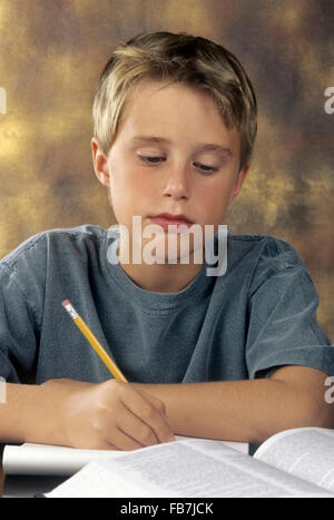 boy doing homework Stock Photo