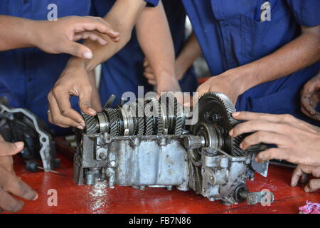 Mumbai, India - October 26, 2015 - Teenager from children«s doing training to become a car mechanician in education center power Stock Photo