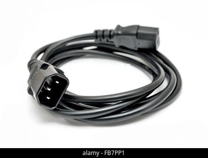 Black power cord with detail on the C14 (IEC320) connector on a white background. Stock Photo