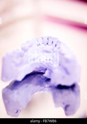 Dental prosthetics clay tooth mold in dentists photo. Stock Photo