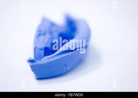 Dental prosthetics clay tooth mold in dentists photo. Stock Photo