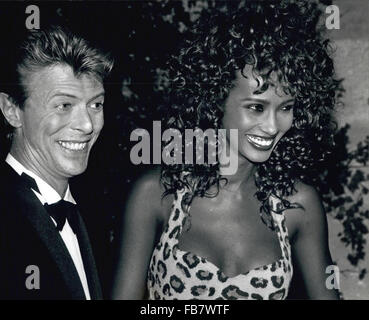 DAVID BOWIE, the infinitely changeable, fiercely forward-looking songwriter who taught generations of musicians about the power of drama, images and personae, died Sunday surrounded by family. He was 69. Bowie died after an 18-month battle with cancer. Pictured: Sep. 20, 1991 - Paris, France - Pop Singer DAVID BOWIE and supermodel girlfriend IMAN at the presentation of the film, 'Anima mundi'. (Credit Image: � Keystone USA via ZUMAPRESS.com) Stock Photo