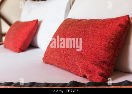 Double bed with pillows in red color.sensitive focus Stock Photo