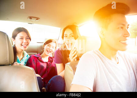 young group people enjoying road trip in the car Stock Photo