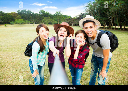 Top view of  happy young group making selfie by  smart phone Stock Photo