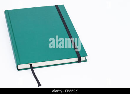 Image shows a green notebook isolated on white background Stock Photo