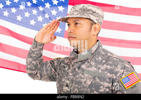 portrait of American soldier saluting on us flag background Stock Photo