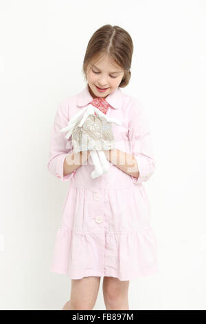 little girl and toy rabbit Stock Photo