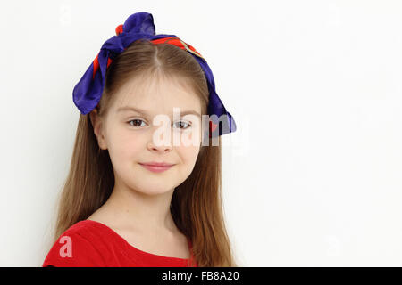 Smiley happy little lady in red Stock Photo