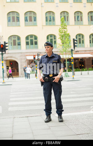 Sweden, Uppland, Stockholm, Policewoman looking away