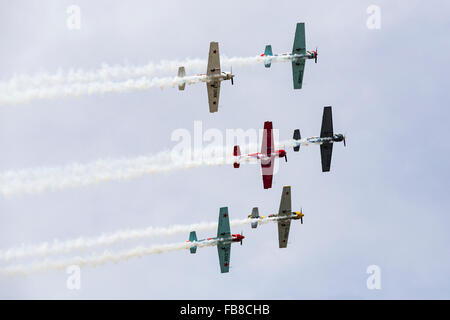 Aerostars aerobatic display team in YAK-50s, Farnborough International Airshow, Farnborough Airport, Rushmoor, Hampshire, Englan Stock Photo