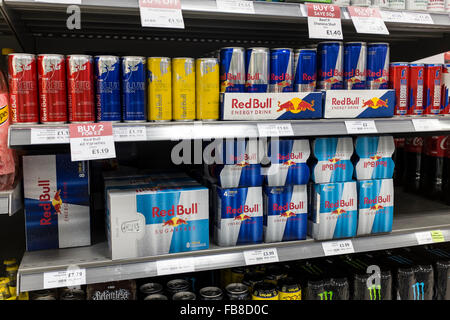 Multi packs of energy drinks on shelves in a supermarket, UK Stock Photo