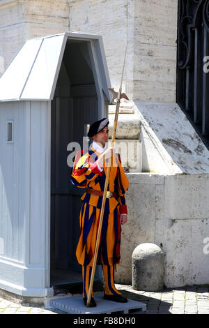 Member of the Swiss Guard on duty outside Saint Peters Basilica in the Vatican. Stock Photo