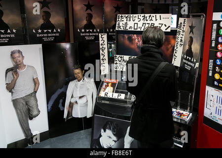 Tokyo, Japan. 12th January, 2016. A man looks at the discography of David Bowie on sale at Tower Records in Shibuya on January 12, 2016, Tokyo, Japan. Tower Records created a special section for the British singer, songwriter and actor David Bowie, who died of cancer at the age of 69 on January 10, 2016. His recently released album Blackstar is now sold out in Japan. Credit:  Rodrigo Reyes Marin/AFLO/Alamy Live News Stock Photo