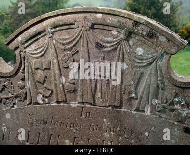 The headstone of Ralph Edward's in Partrishow churchyard, Powys, Mid Wales. The symbols suggest he was an artist. Stock Photo