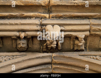 Detail of the Seven Sacraments above the south door St Cybi's Church,  Holyhead, Anglesey, North Wales, UK. The central angel carries a winged heart. Stock Photo