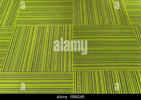 Vintage lime green carpet tiles background. Stock Photo