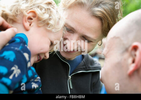 Sweden, Ostergotland, Vikbolandet, Parents laughing with their son (2-3) Stock Photo