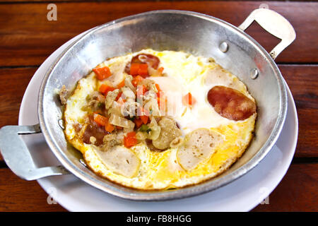 Indochina pan-fried egg with toppings in my homemade Thai style,Vietnamese Omelette,egg pan.Pan omelette. Stock Photo