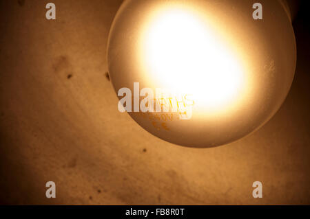 woolworths bulb in anglepoise lamp,wall, desk, lamp, business, bulb, elements, contemporary, spotlight, light, shades,dusty Stock Photo