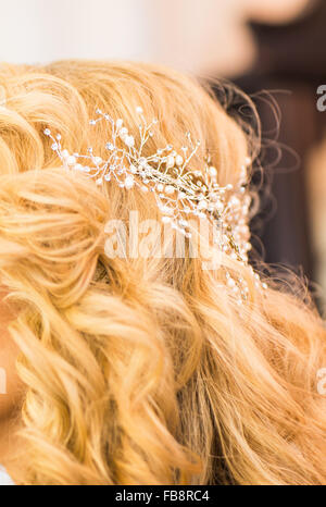 Bride's hair, styled with a hair ornament. Wedding accessories Stock Photo