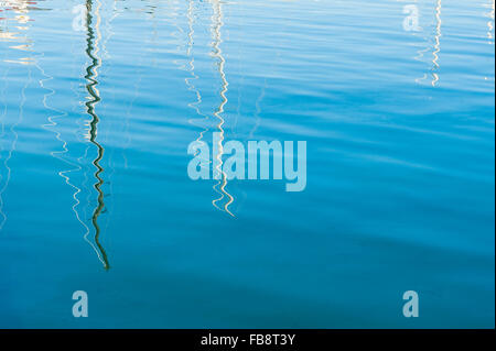 Reflection of yacht masts in the harbour in Ibiza,Spain, Europe Stock Photo