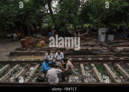 Playing cards along the train tracks. India Railways. Delhi, India. Stock Photo