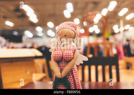 Doll in it is red a white dress made hands of fabric. Stock Photo