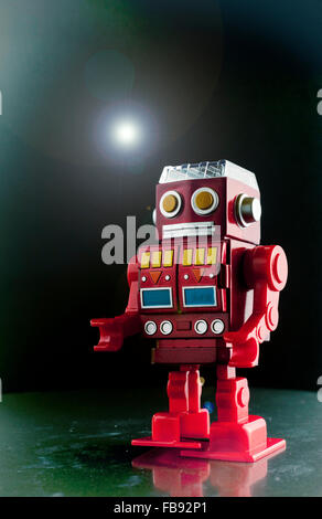 Toy Robot, red plastic walking robot. Stock Photo