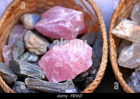 Nepalese pink quartz stones set for sale inside a wicker basket in the windowshop of a souvenirs+minerals selling shop-Kathmandu Stock Photo