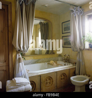Striped Shower Curtains On Bath With Reclaimed Carved Wood Panel