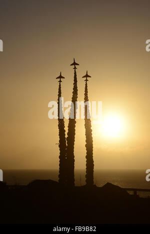 Sunrise over the memorial to Red Arrows pilot Jon Egging on Bournemouth cliff-top.