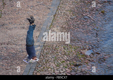 Man exercising on head at the Peter and Paul Fortress, St Petersburg, Russia Stock Photo