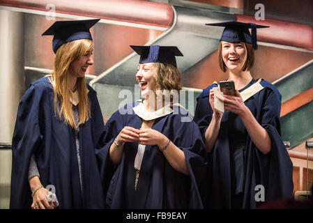 Three happy, smiling young women graduands, graduation ceremony UK Stock Photo