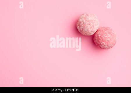 pink marzipan balls on pink background Stock Photo