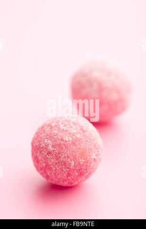 pink marzipan balls on pink background Stock Photo