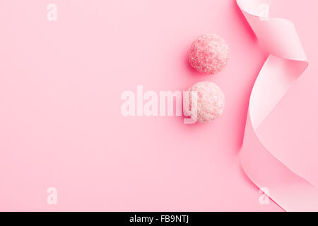 pink marzipan balls on pink background Stock Photo