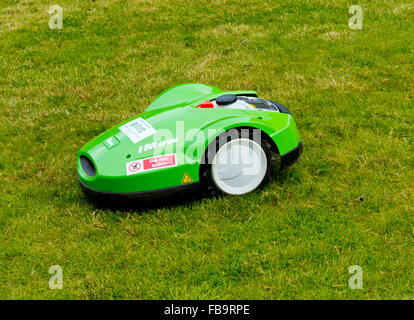 Viking Imow battery powered robotic lawn mower cutting grass using modern technology Stock Photo