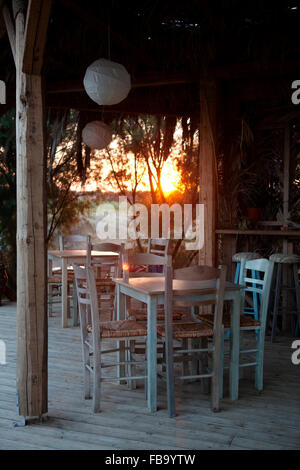 Greek tavern exterior tables near Xi beach Megas Lakkos beach, Lixouri, Kefalonia, Greece Stock Photo