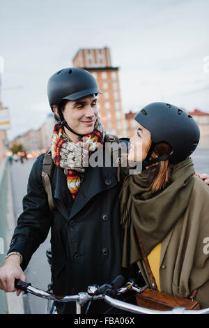 Sweden, Uppland, Stockholm, Vasatan, Sankt Eriksgatan, Young couple with bicycles on street