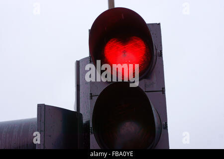 Red street light in heart shape, Akureyri, Iceland Stock Photo