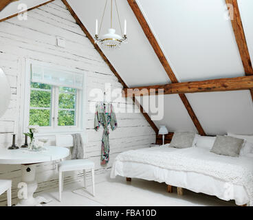 Sweden, Attic bedroom in rustic style