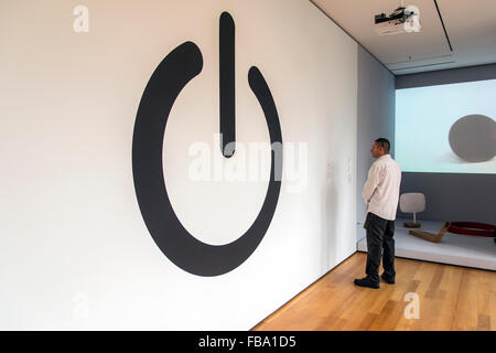 Visitor watching the IEC Power Symbol at Museum of Modern Art (MoMA), Manhattan, New York, USA Stock Photo